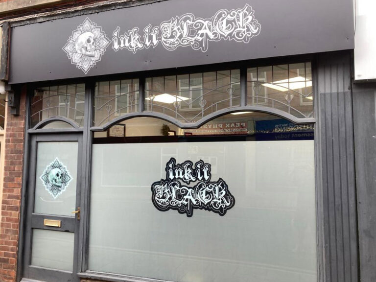 Ink it Black shop frontage with window frosting and graphics